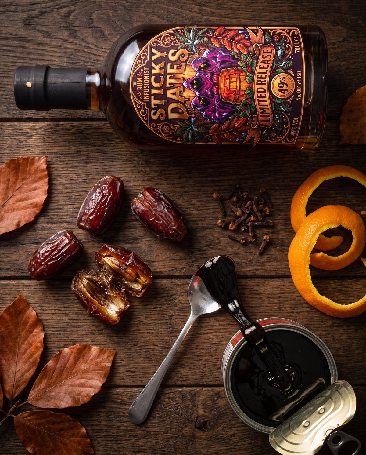 Overhead flat lay of Sticky Dates rum with medjool dates, dark treacle and whole cloves
