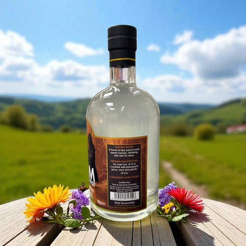 Back label of Peach & Mango on a table with flowers