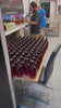 Bottling a batch of rum by hand at The Rum Infusionist distillery