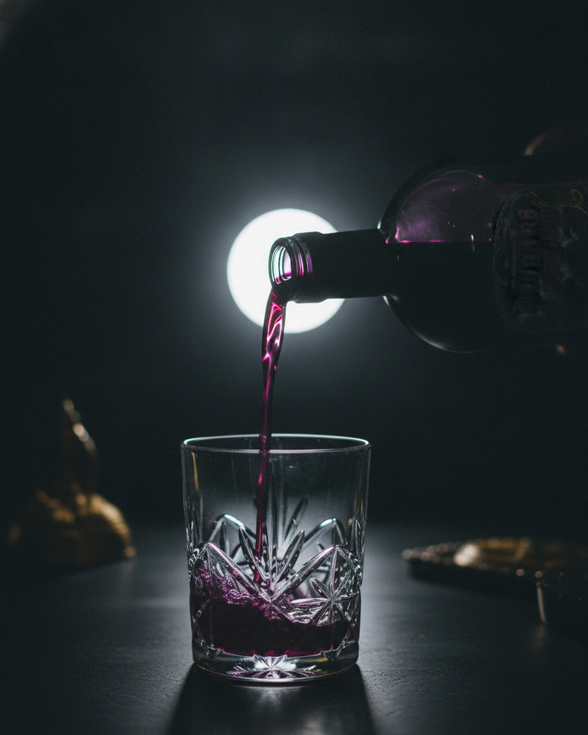 The pour: deep purple Rhubarb & Custard Witching Hour falling into the glass